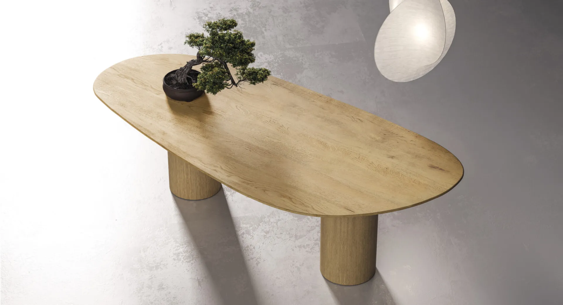 Piano a ciottolo del tavolo Stone Devina Nais con bonsai