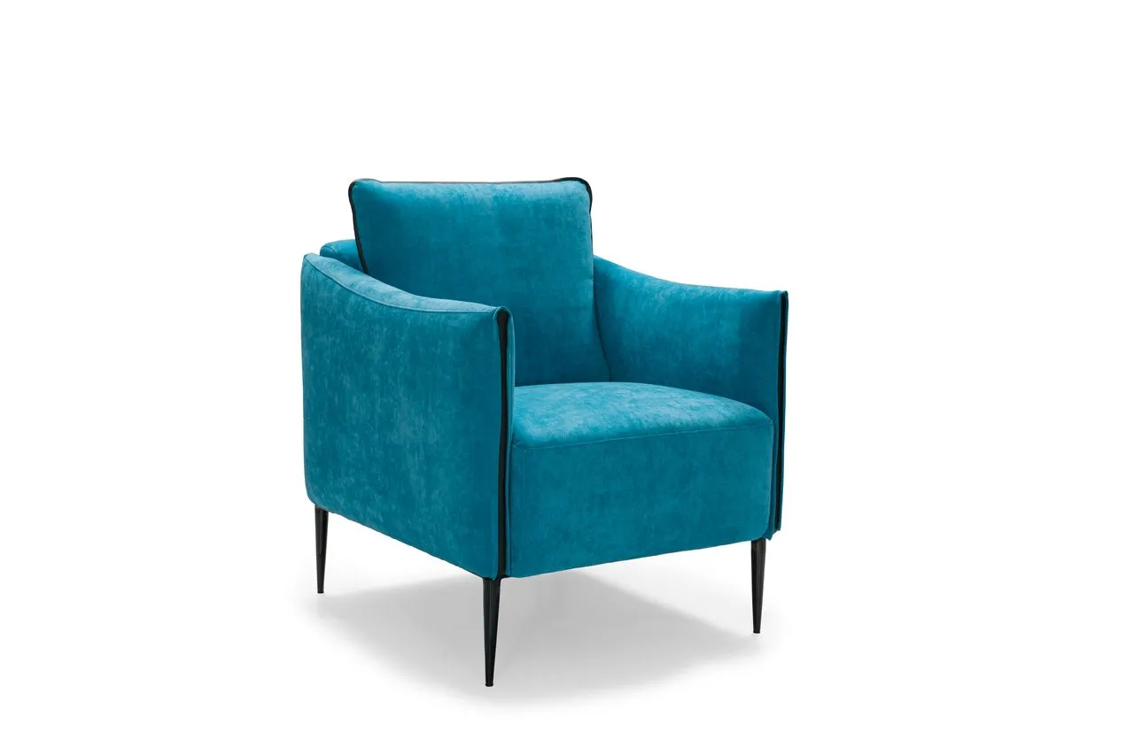Poltrona Elma Max Sofà blu con gambe sottili scure, vista di tre quarti