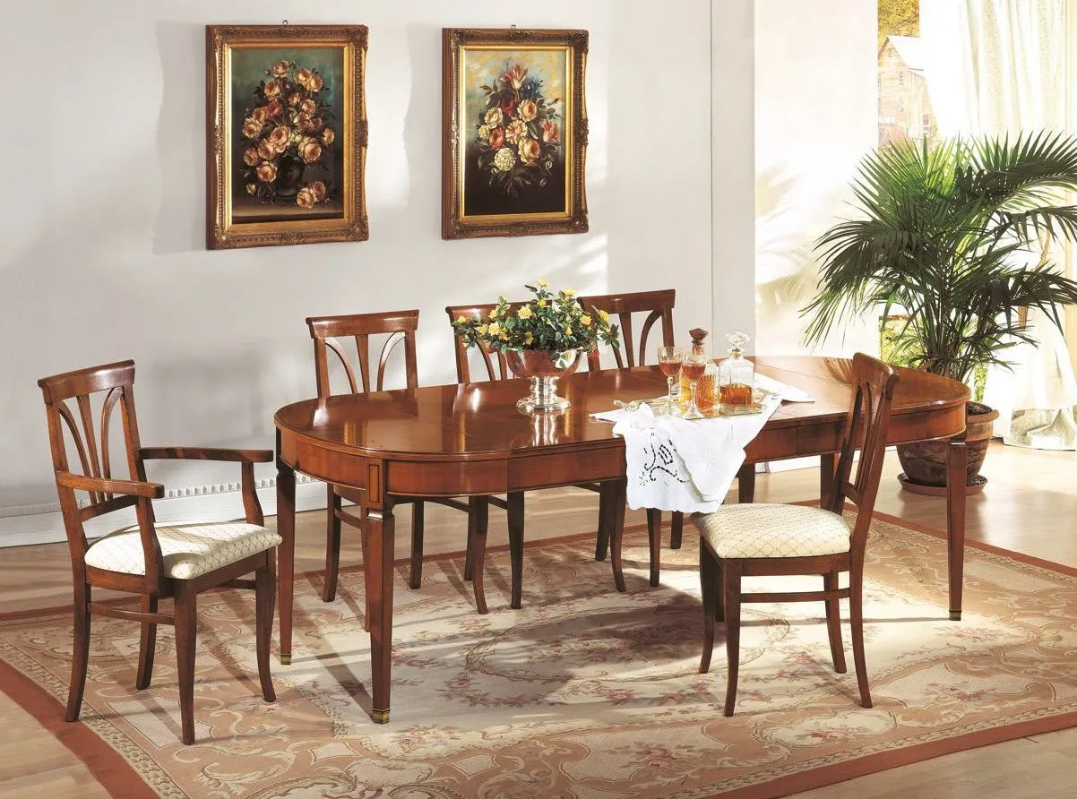 Tavolo ovale allungabile Trend Style Imba in noce con sedie imbottite sotto due quadri