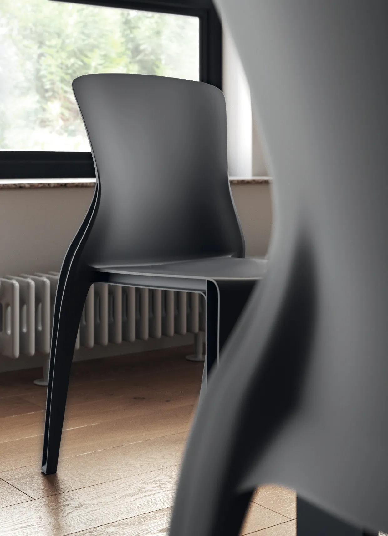 Dettaglio dello schienale sinuoso della sedia Future Scavolini nera
