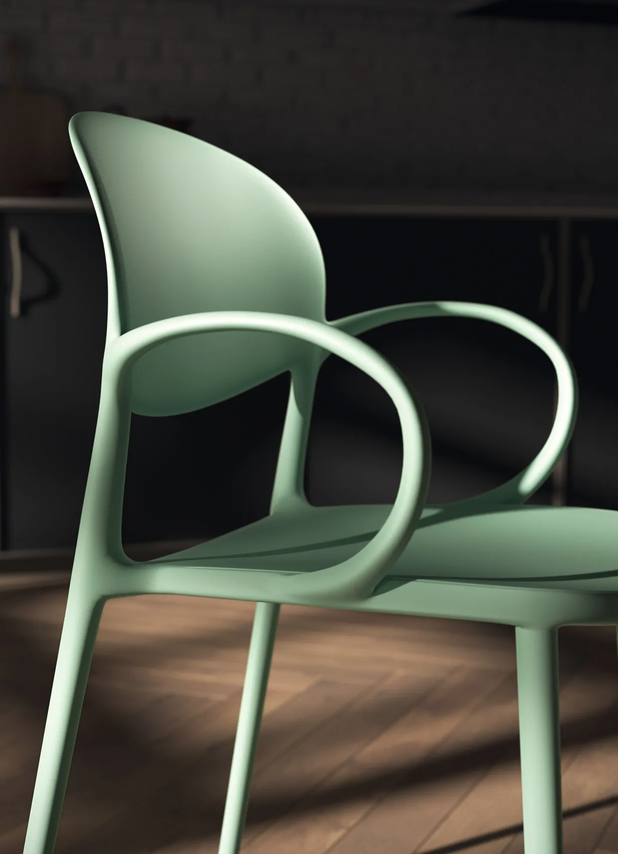 Dettaglio del bracciolo curvo della sedia House Scavolini verde salvia