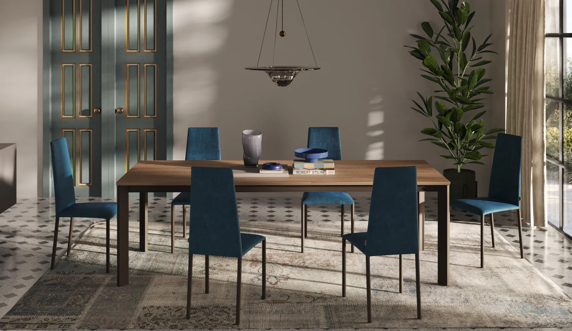 Sedie Liam Scavolini blu petrolio attorno a un lungo tavolo in legno