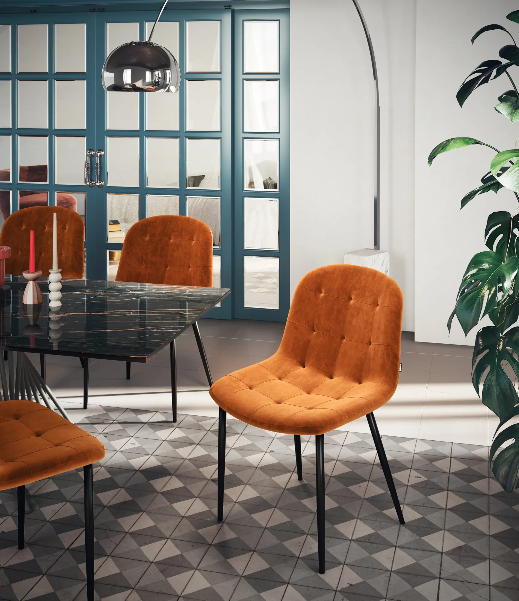 Sedie Soft Scavolini in velluto arancio attorno a un tavolo in vetro