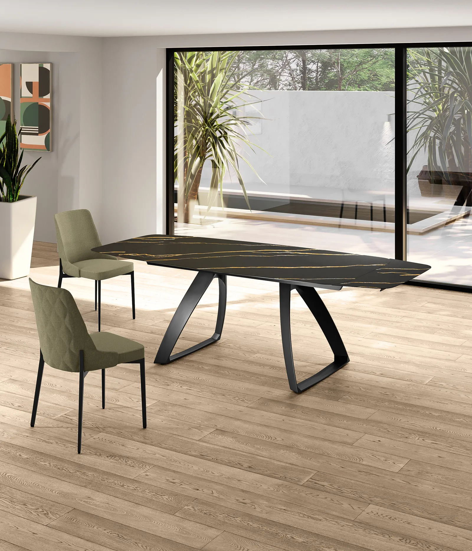 Tavolo Barrel Stones Portoro nero con sedie verdi su un parquet chiaro
