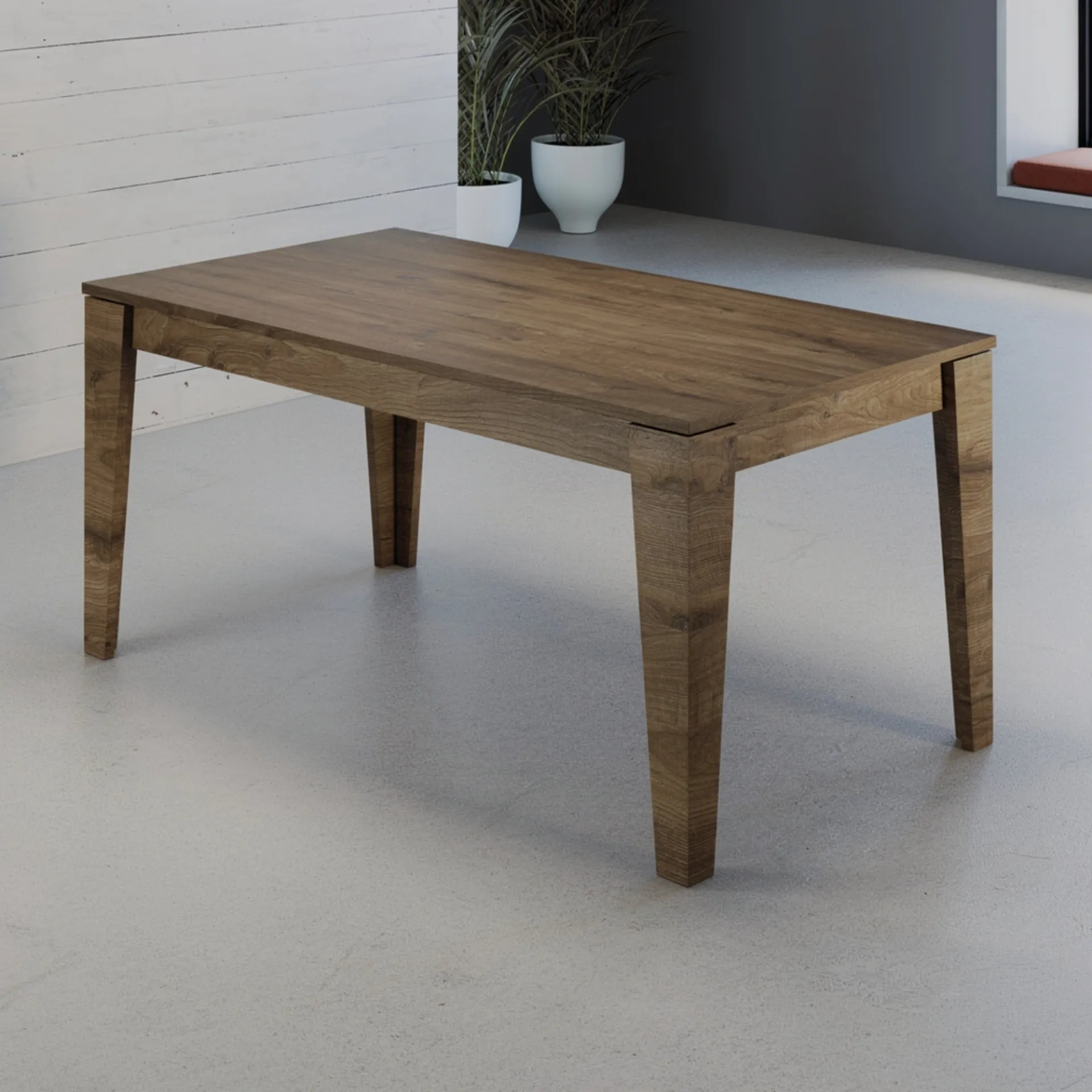 Tavolo allungabile Arlen Tecnolegno in melaminico effetto legno scuro in un ambiente con pareti grigie