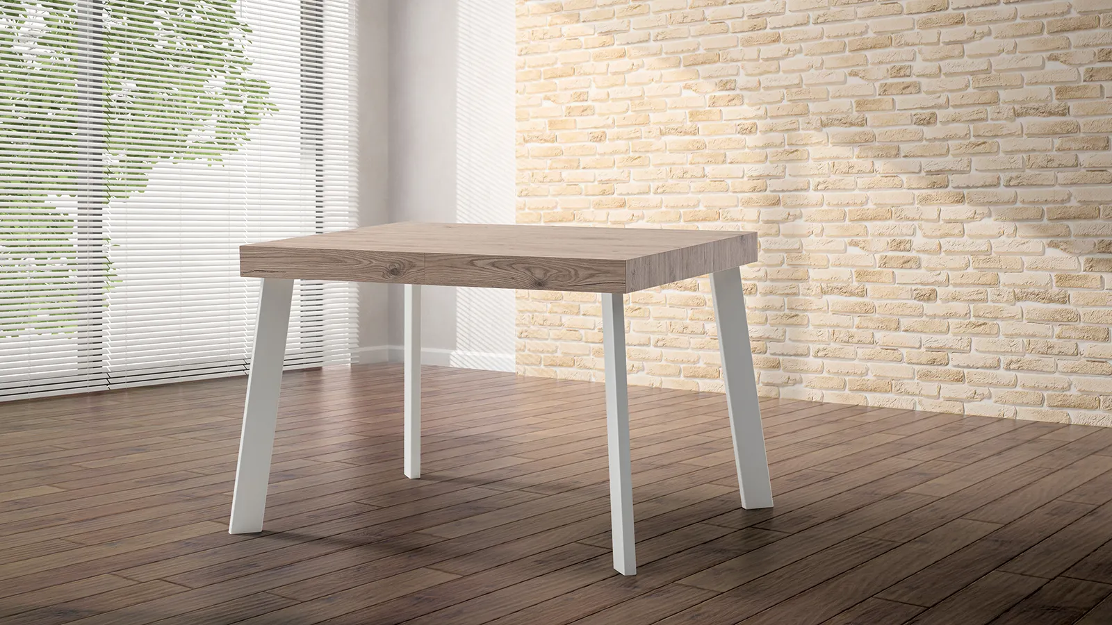 Tavolo Colonia Tecnolegno con piano effetto legno e gambe bianche davanti a un muro in mattoni