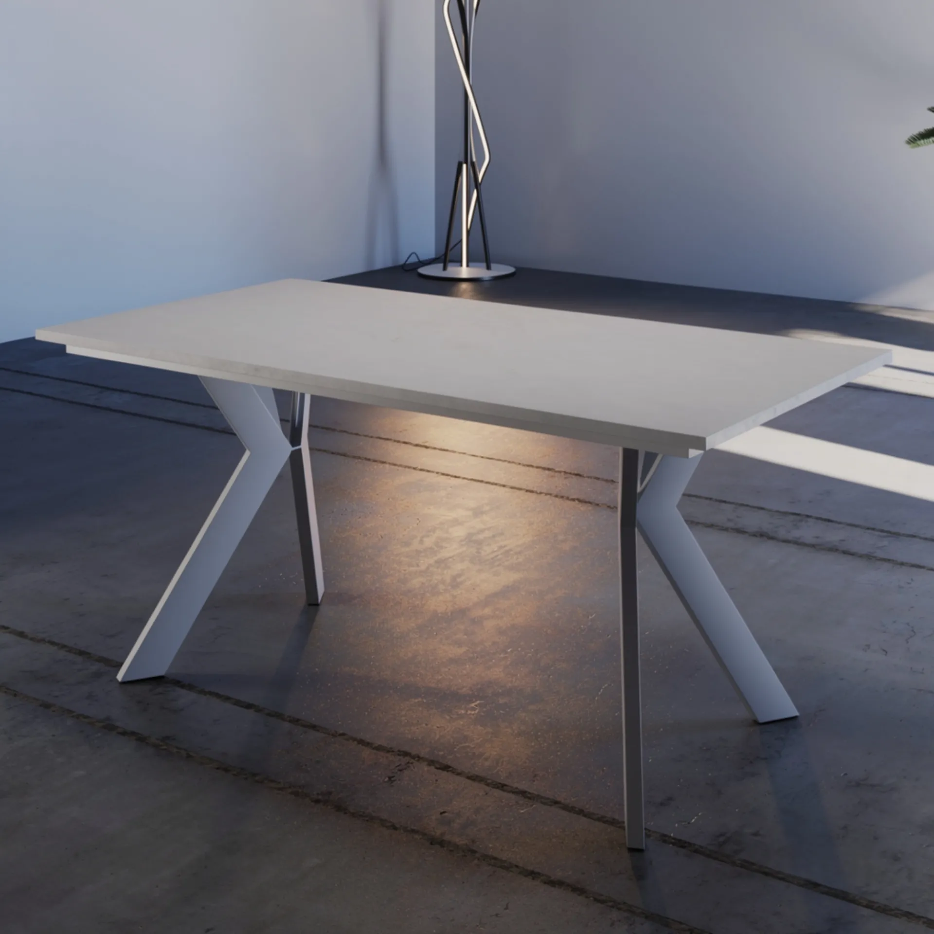 Tavolo allungabile Nuoro Tecnolegno con piano bianco e gambe a Y bianche sotto una lampada