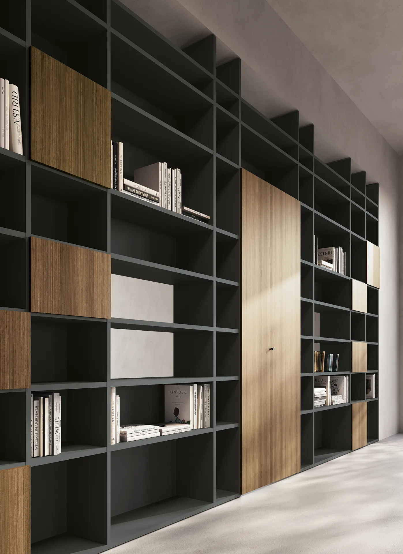 Libreria Infinity Colombini Offic'è a terra con vani neri e pannelli in legno