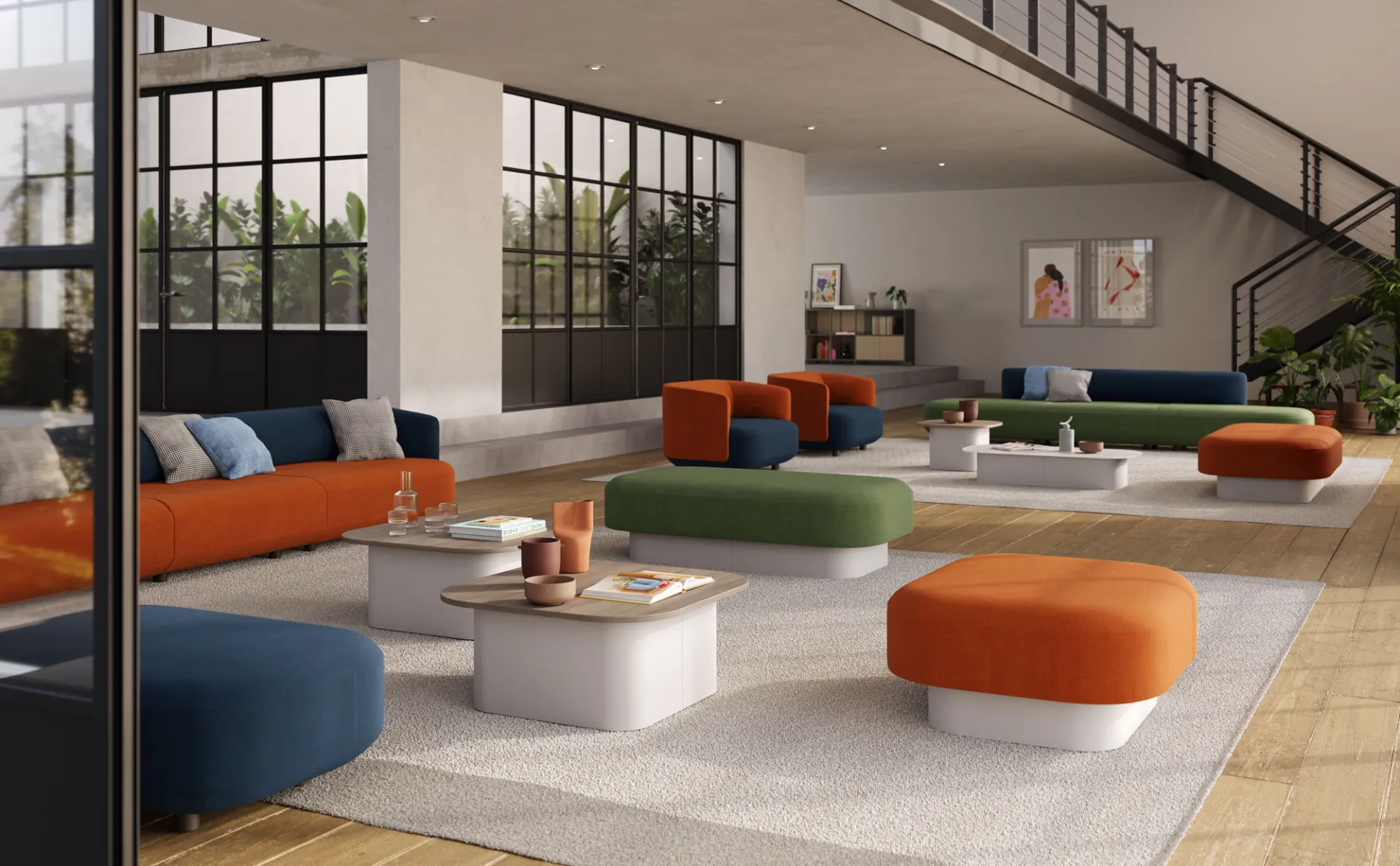 Divani Afina Frezza di vari colori in un grande open space con pouf