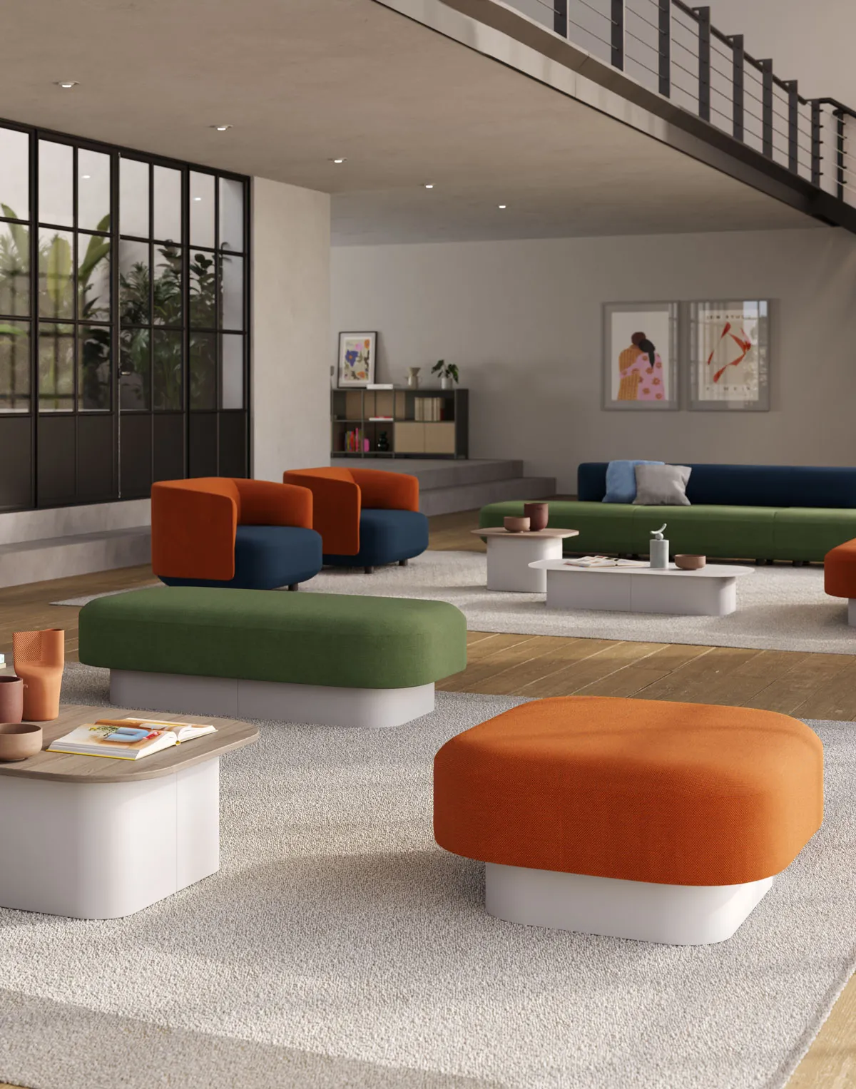 Pouf Afina Frezza arancio in un open space con divani colorati
