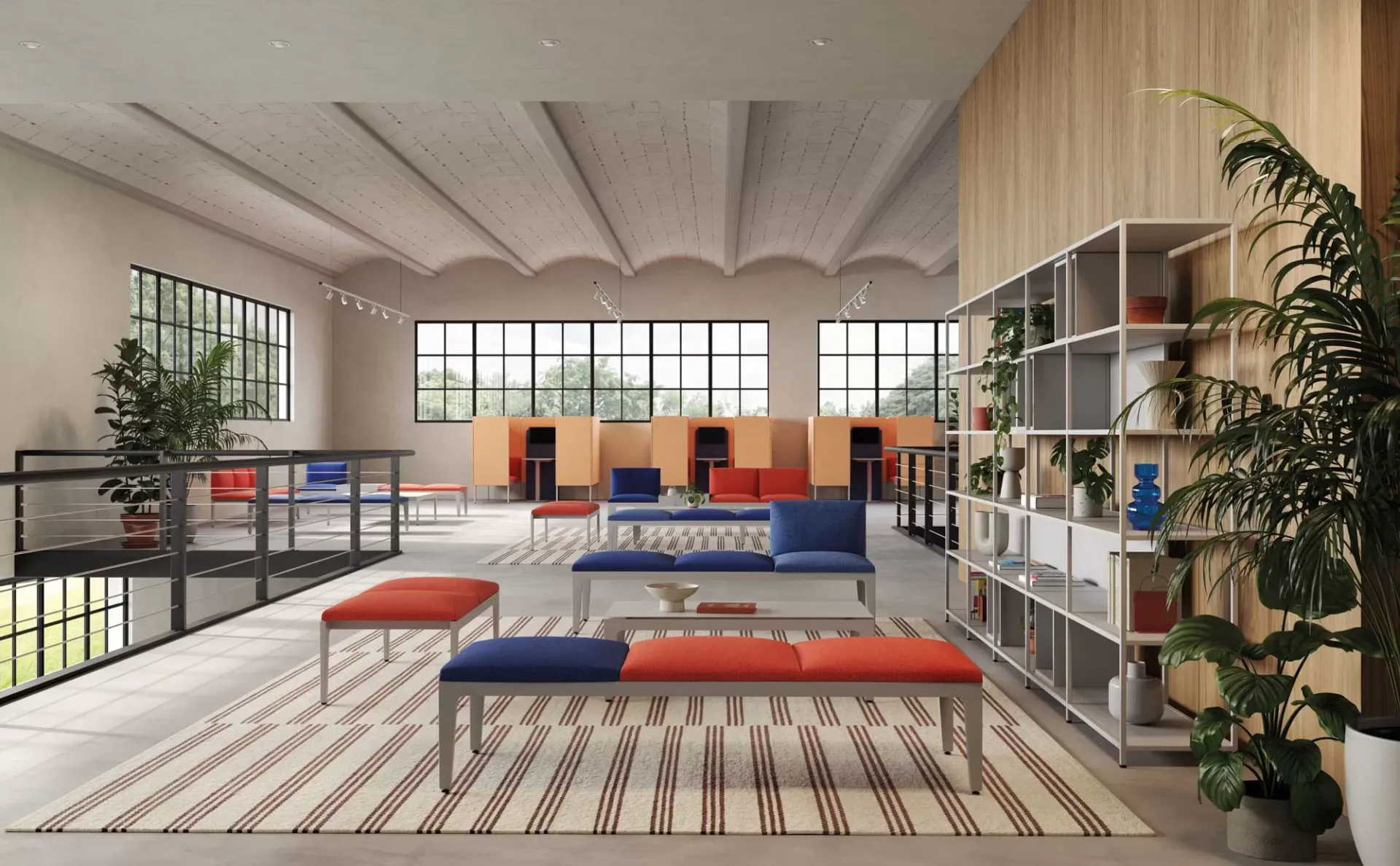 Panche Alplus Frezza rosse e blu in un open space con librerie