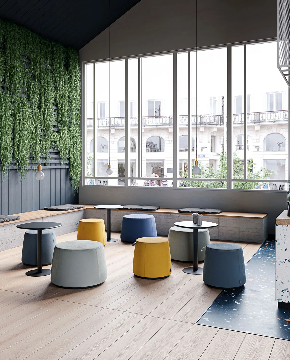 Pouf C1.8 Frezza colorati attorno a tavoli alti in una sala