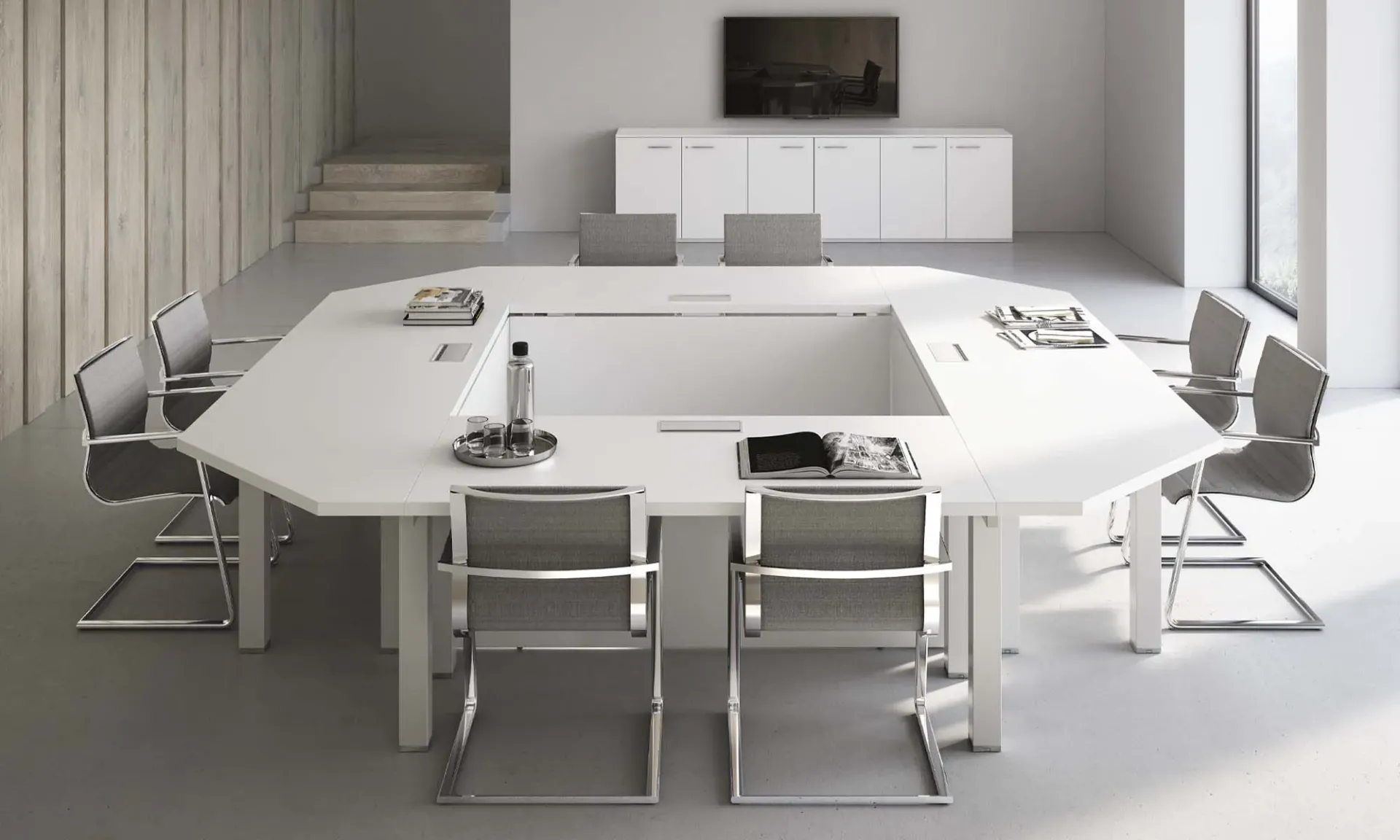 Tavolo riunione Asset Frezza ottagonale bianco con sedie a slitta