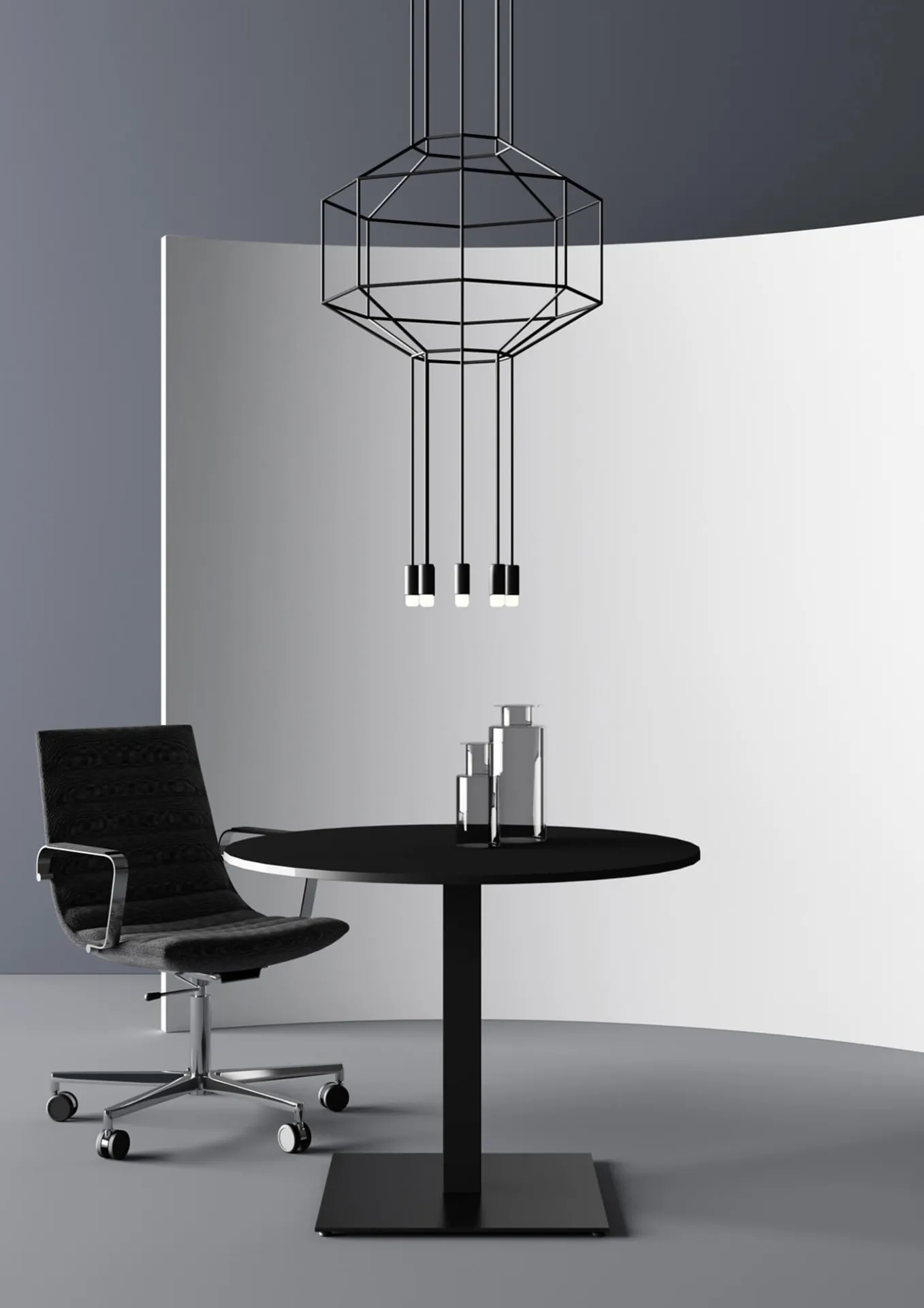 Tavolo Pop Frezza rotondo nero con poltroncina nera sotto un lampadario geometrico