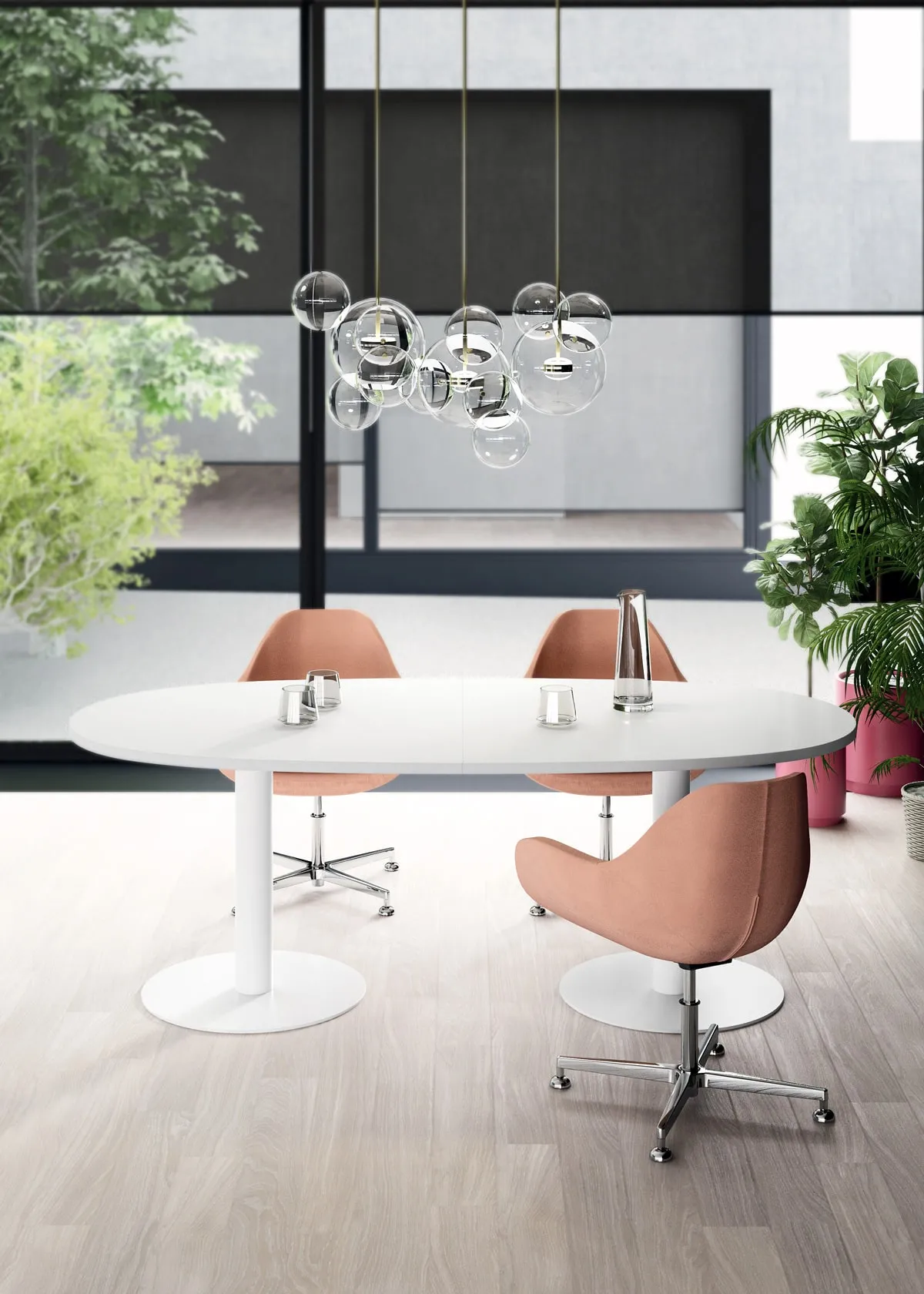 Tavolo riunione ovale Pop Tee Frezza bianco con poltroncine rosa sotto lampade a sfera