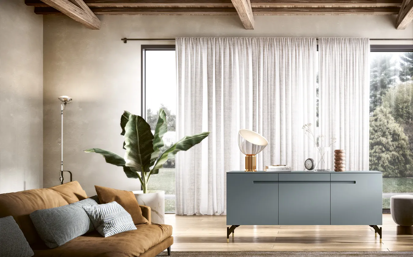 Madia Ink 2B Italia blu con maniglie scavate in un soggiorno luminoso