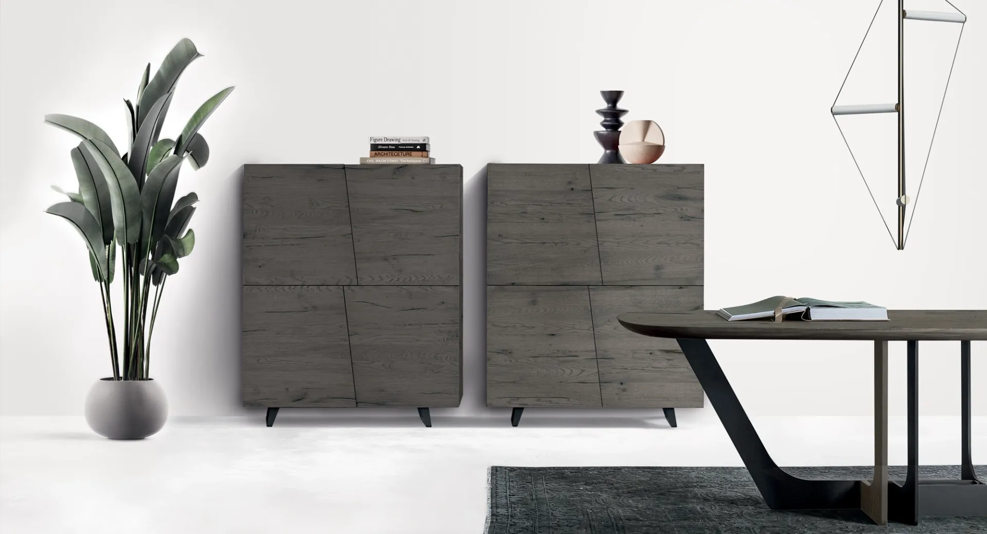 Dispense Unika Devina Nais in rovere grigio accanto a un tavolo da pranzo