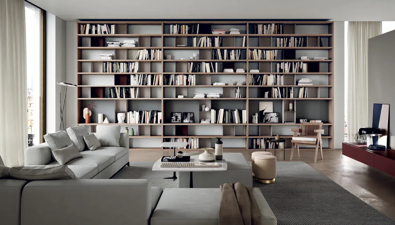 Libreria Line Up 03 Dielle Modus a tutta parete in un soggiorno luminoso
