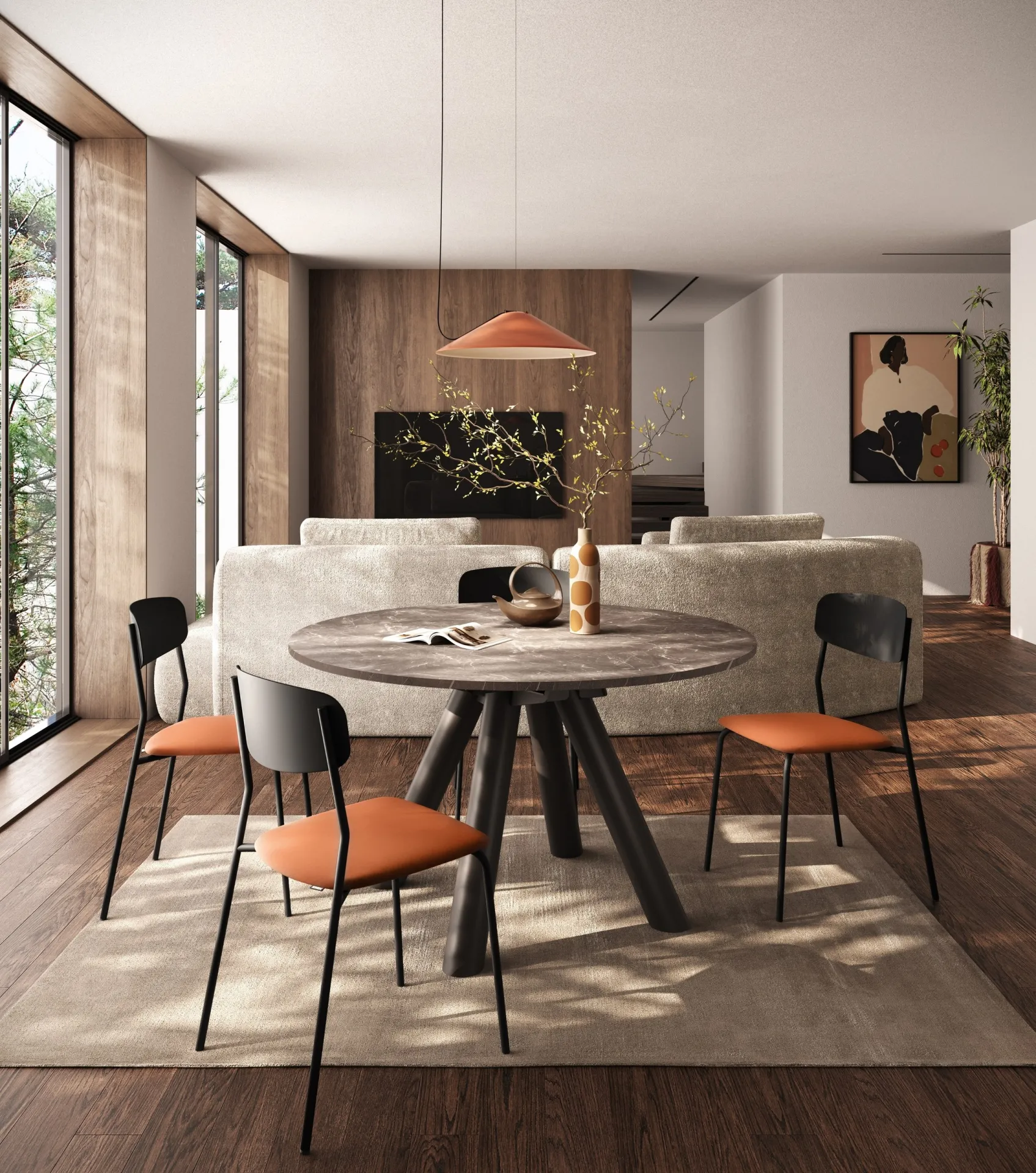 Tavolo Note Scavolini con piano effetto pietra e sedie arancioni e nere davanti al divano