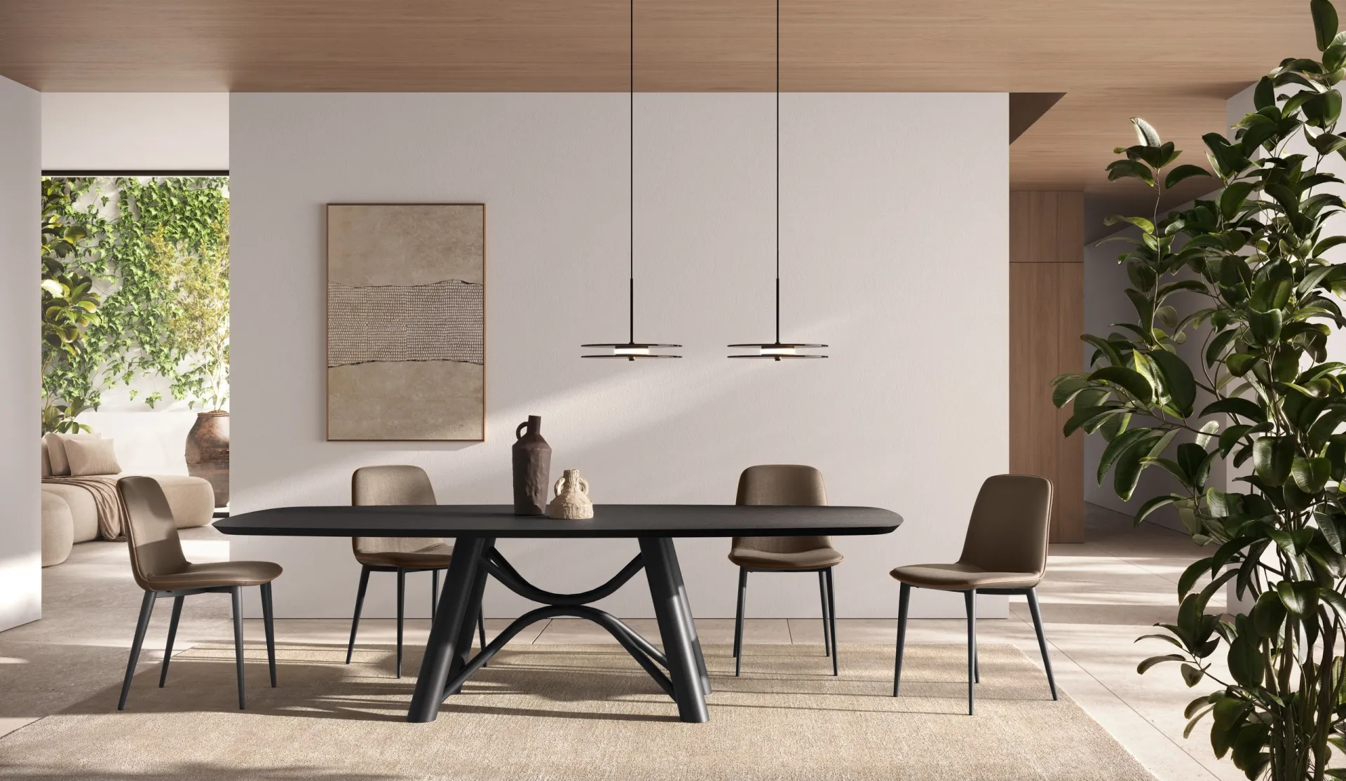 Tavolo Brooklin Scavolini con piano nero sagomato e sedie in tessuto in una sala luminosa