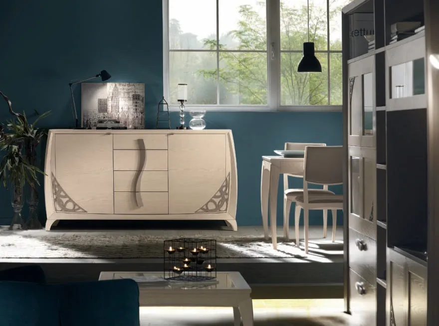 Credenza House Project Imba con traforo e maniglia a onda davanti a una parete blu