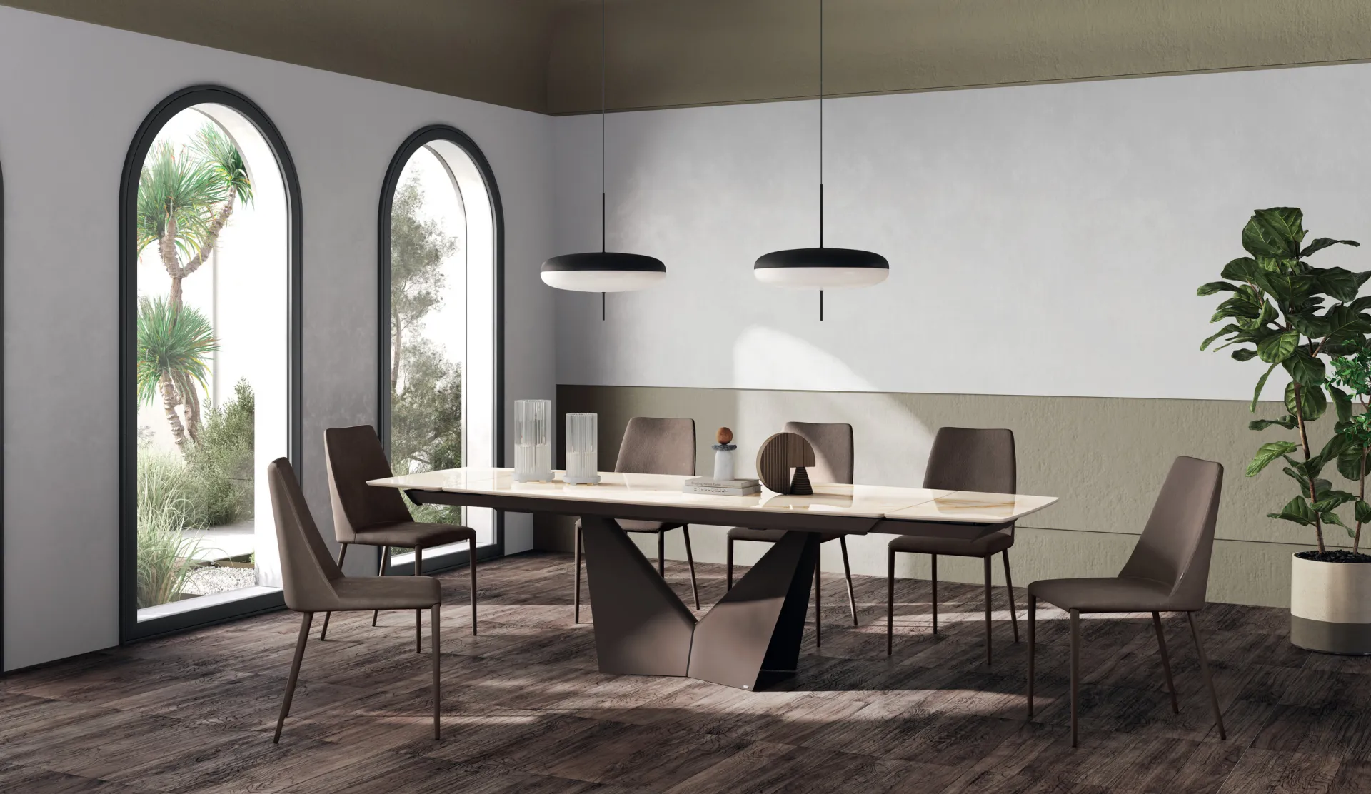 Tavolo Sidney Scavolini con piano chiaro effetto marmo e base a V in metallo vicino a finestre ad arco
