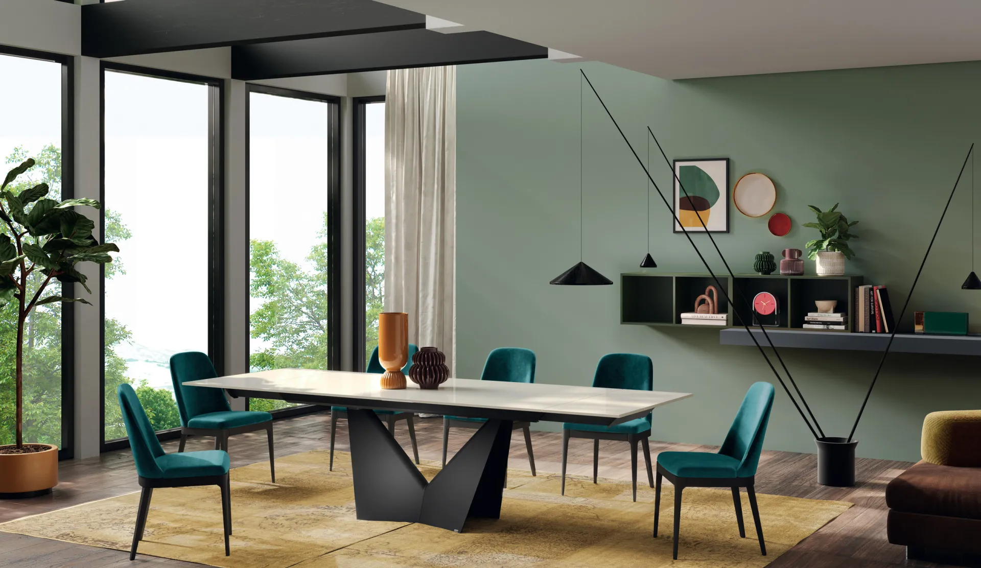 Tavolo Sidney Scavolini allungato con piano chiaro, base a V scura e sedie verde petrolio