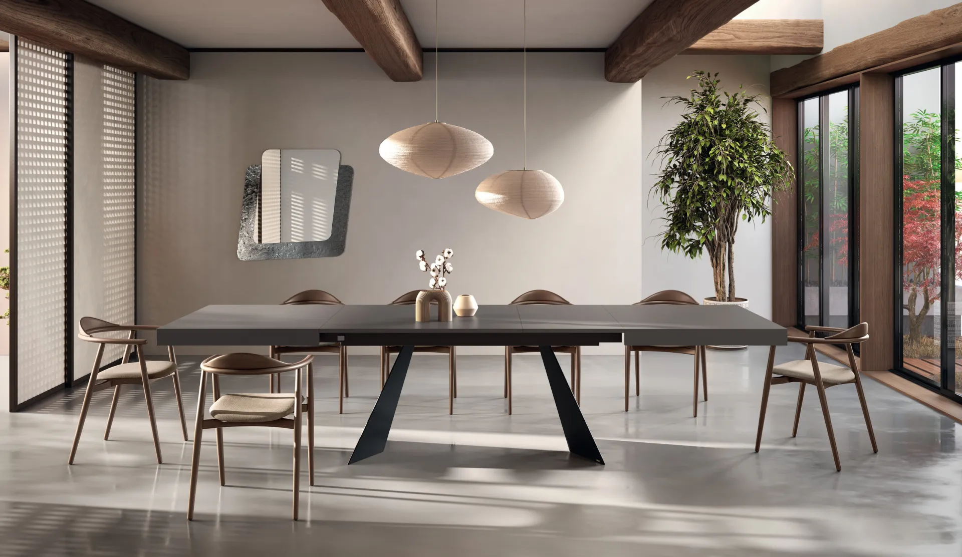 Tavolo Osaka Scavolini allungato con piano grigio scuro e sedie in legno con braccioli