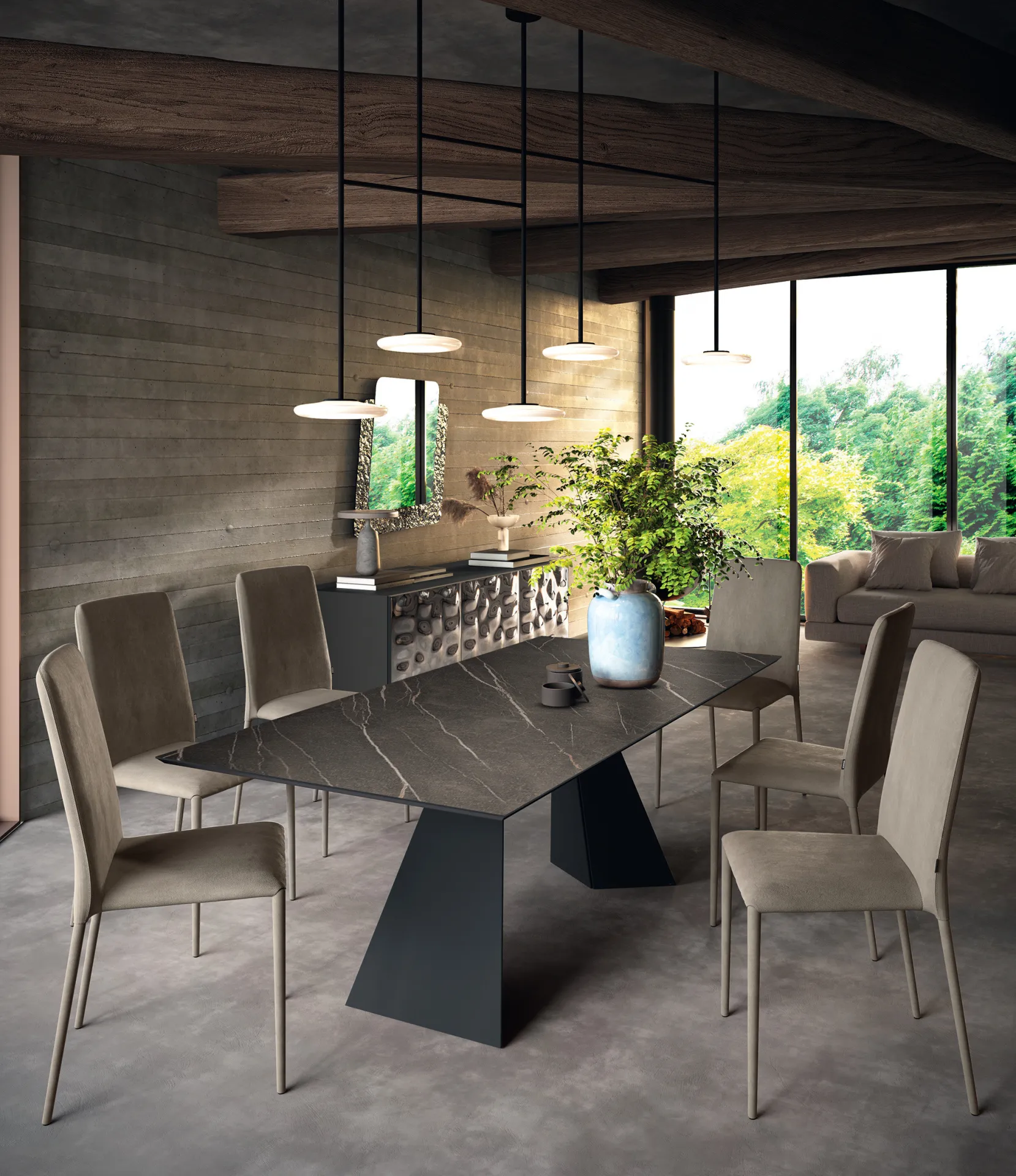 Tavolo Osaka Scavolini con piano scuro effetto marmo visto di testa, con sedie tortora