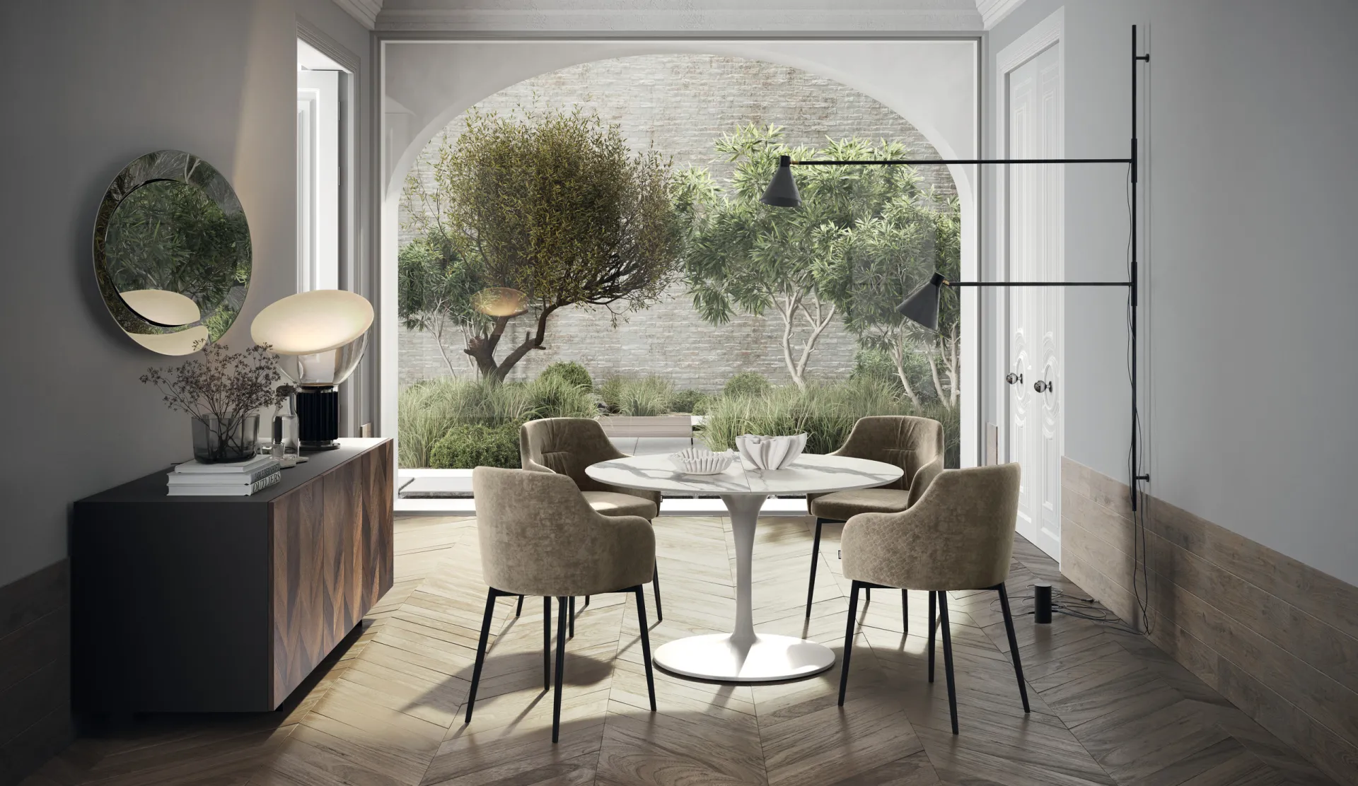 Tavolo Style Scavolini rotondo bianco con base a colonna e poltroncine tortora davanti a un giardino