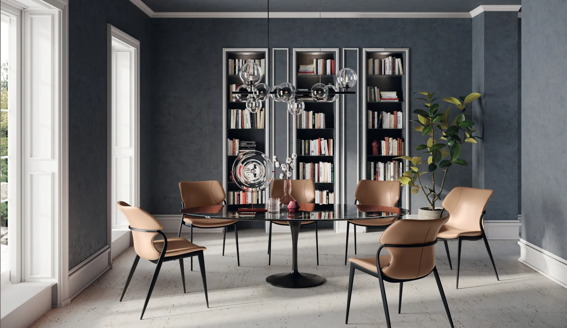 Tavolo Style Scavolini rotondo in versione nera con sedie in cuoio e librerie sullo sfondo