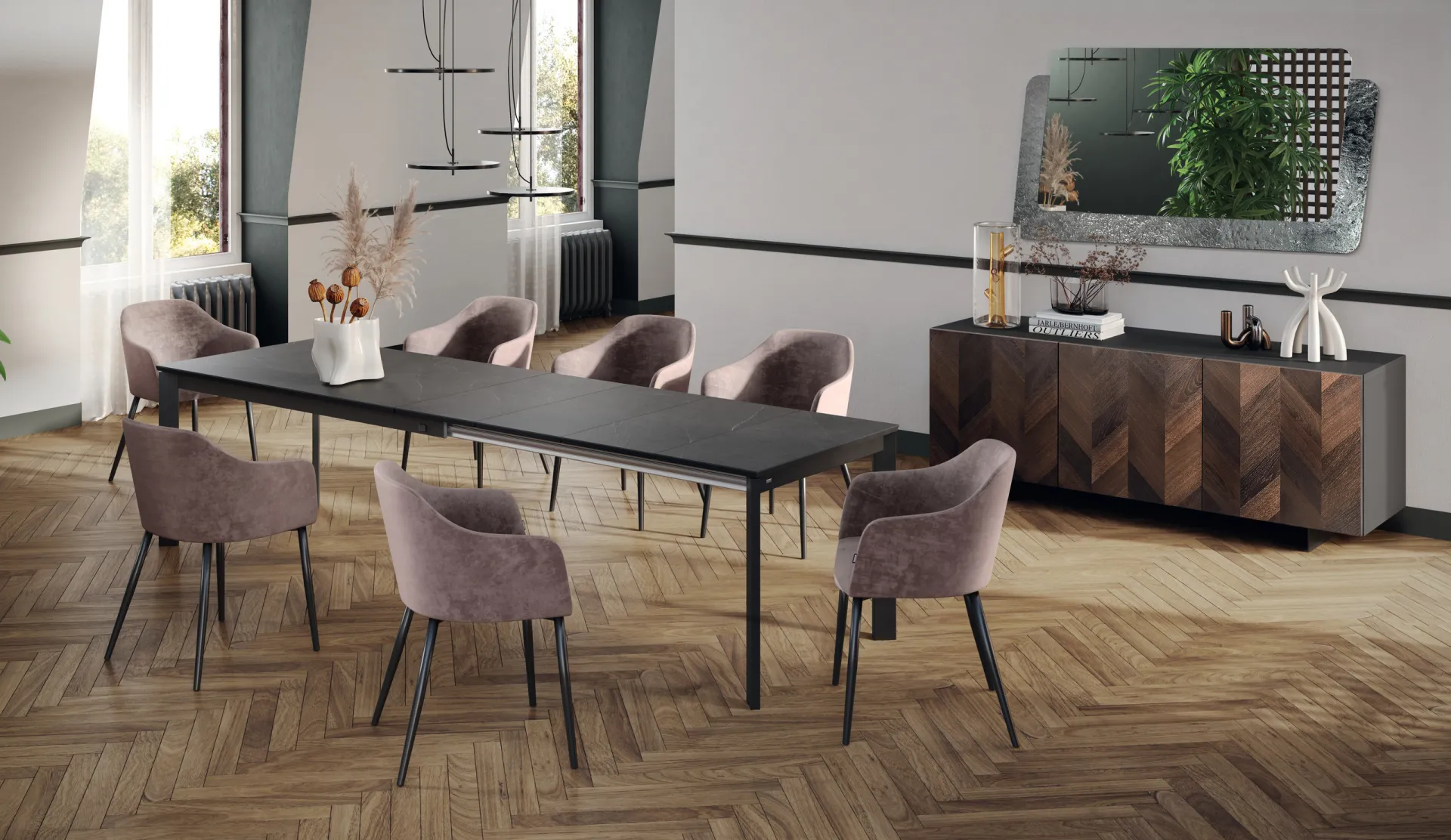 Tavolo Space Scavolini allungato con piano antracite e poltroncine rosa su parquet a spina