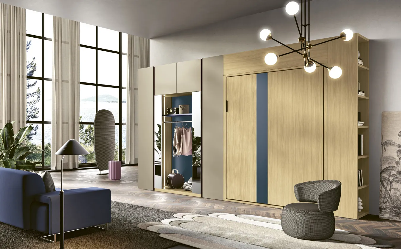 Letto a scomparsa Verticale 2B Italia chiuso in una parete con librerie e luci