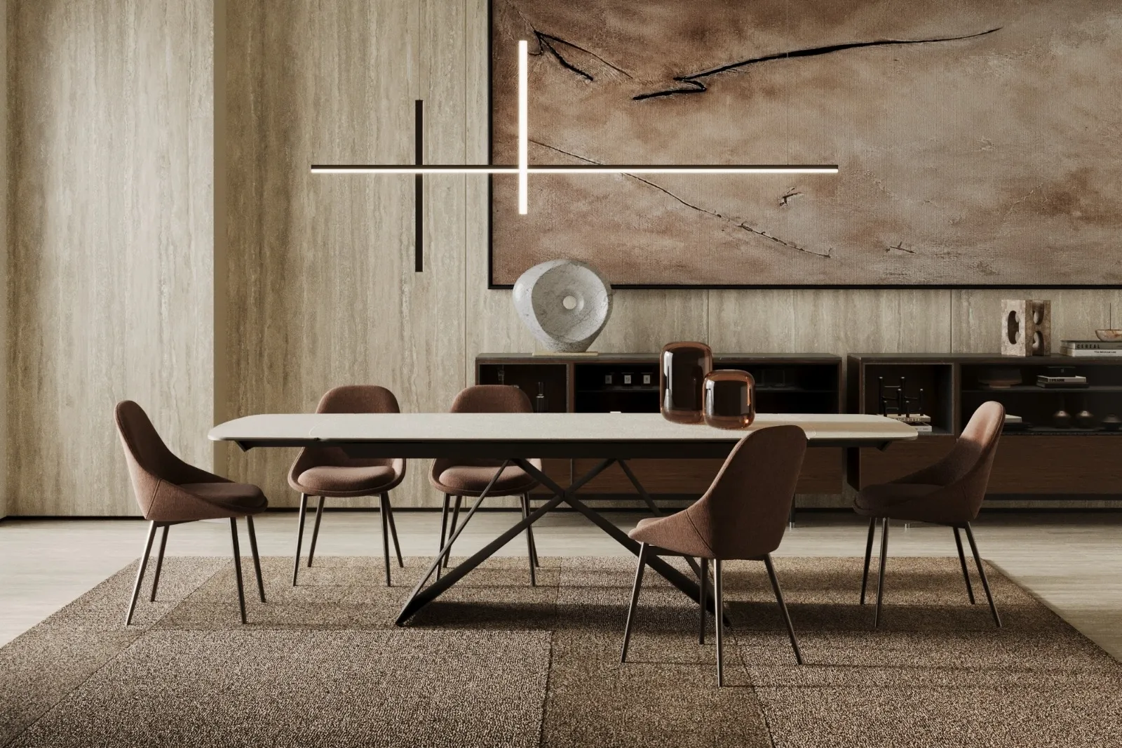 Tavolo Thanos X Stones con piano pietra avorio e base bronzo in una sala da pranzo con parete materica