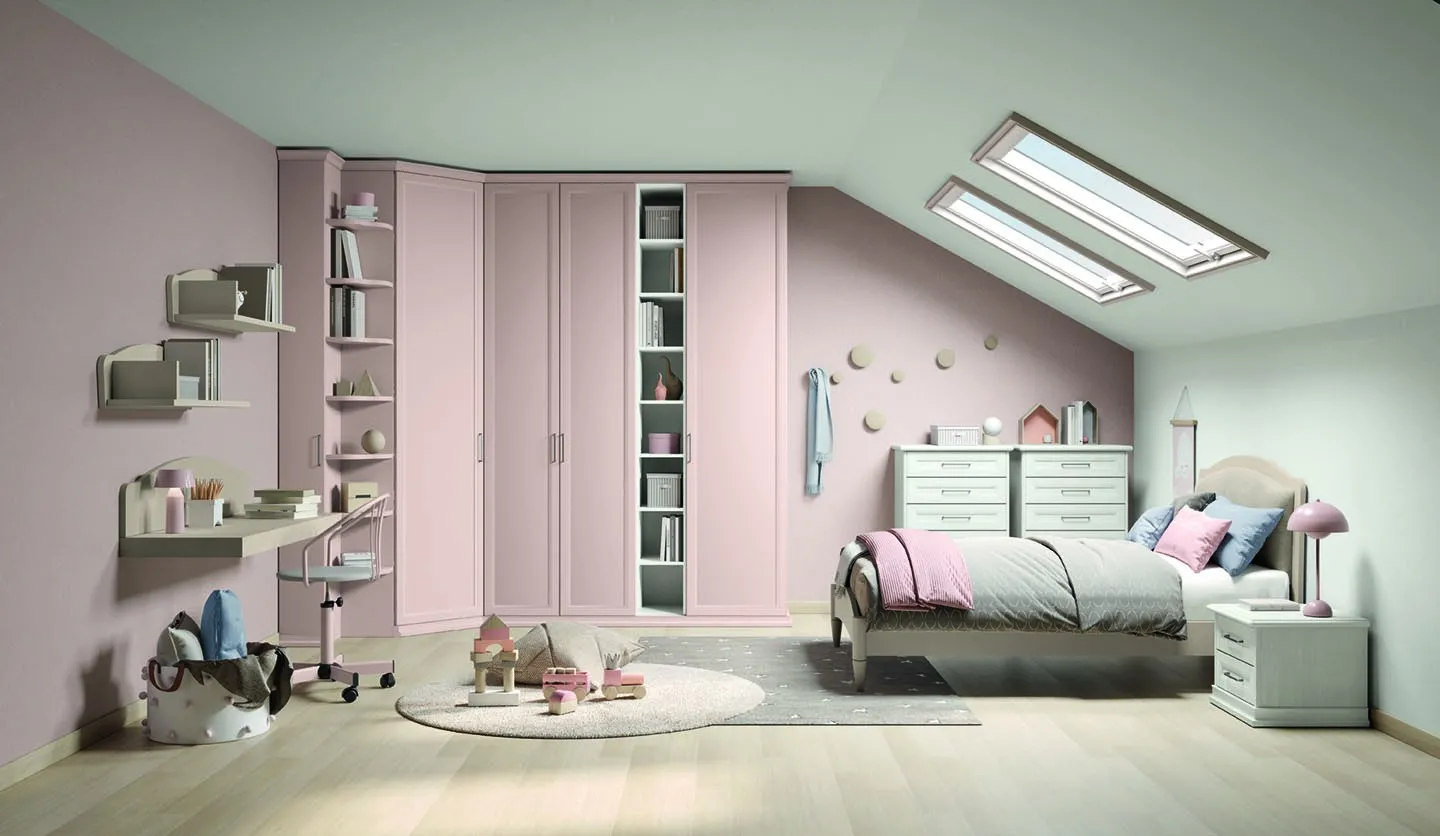 Letto singolo Omega Colombini bianco in una cameretta mansardata con armadi rosa cipria