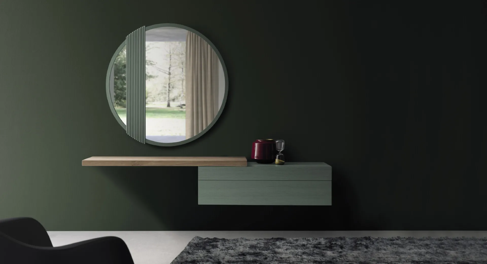 Base sospesa Fly Devina Nais verde salvia con piano in rovere sporgente sotto uno specchio rotondo