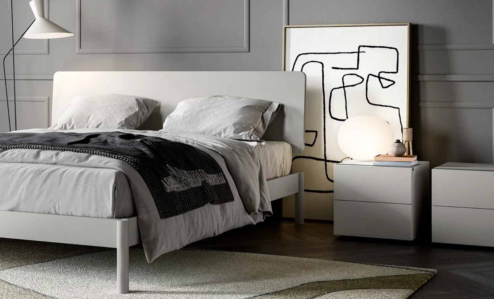 Comodini Line Dielle Modus accanto al letto in una camera grigia