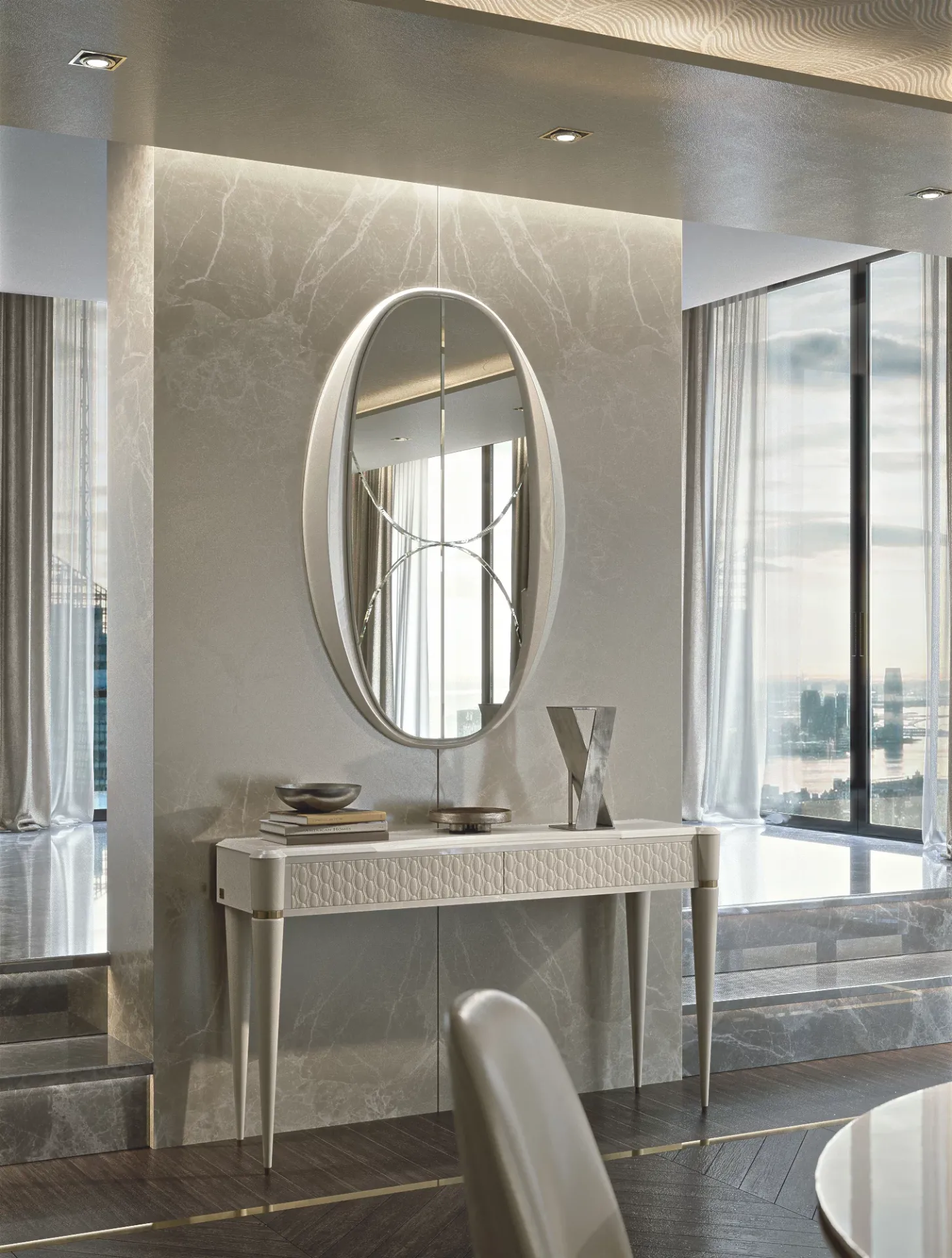 Specchiera ovale Ellipse Francesco Pasi chiara sopra una toilette in una stanza luminosa