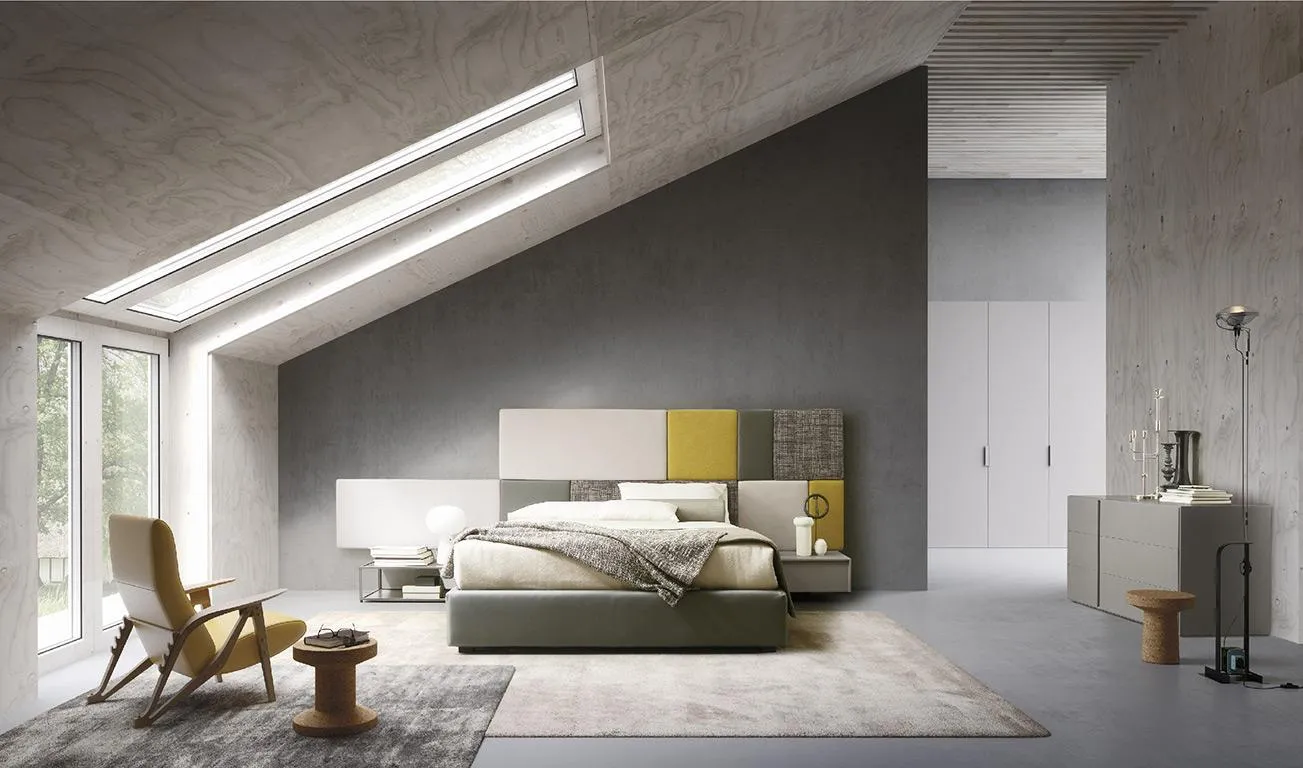Letto Tetris MobilGam con testiera a pannelli colorati in mansarda