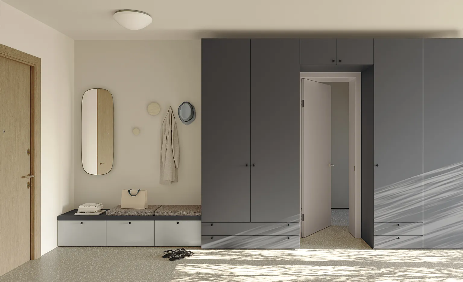 Ingresso Golf Utility Space Colombini con armadio grigio a ponte attorno alla porta e panca a cassetti