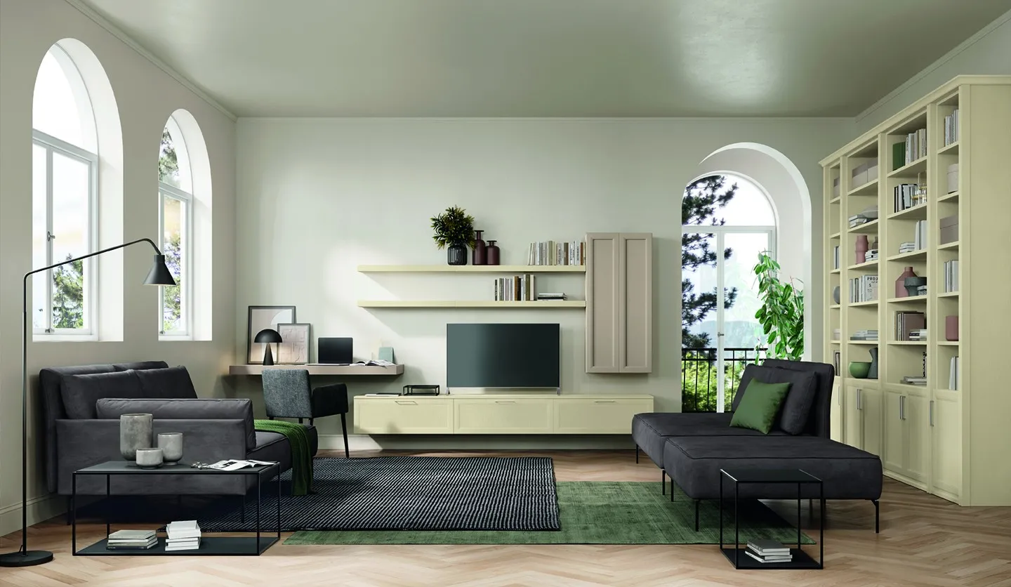 Living Arcadia Mezzogiorno Moderno Colombini con librerie canapa, mensole e scrivania tra finestre ad arco
