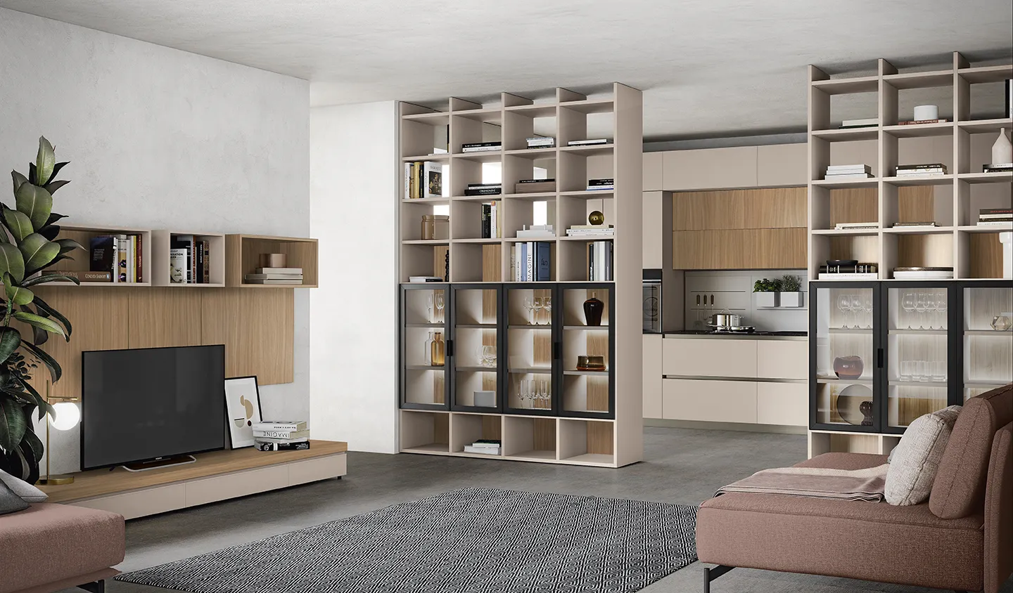 Libreria Infinity Colombini in legno usata come divisorio tra salotto e cucina