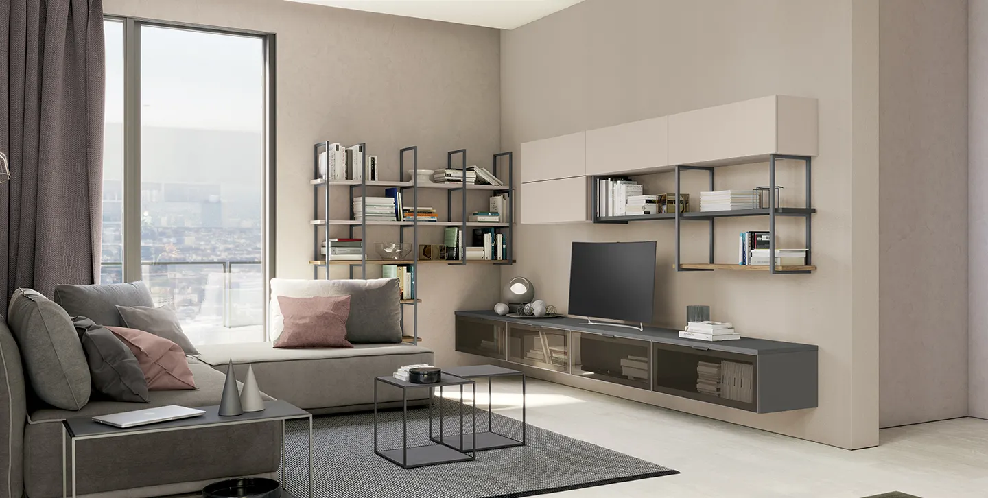 Libreria Up&Up Colombini con struttura in metallo scuro in un soggiorno con base sospesa e pensili