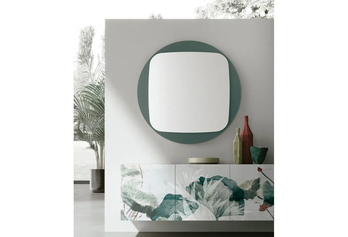 Specchio Space Target Point con vetro verde alga sopra una madia decorata
