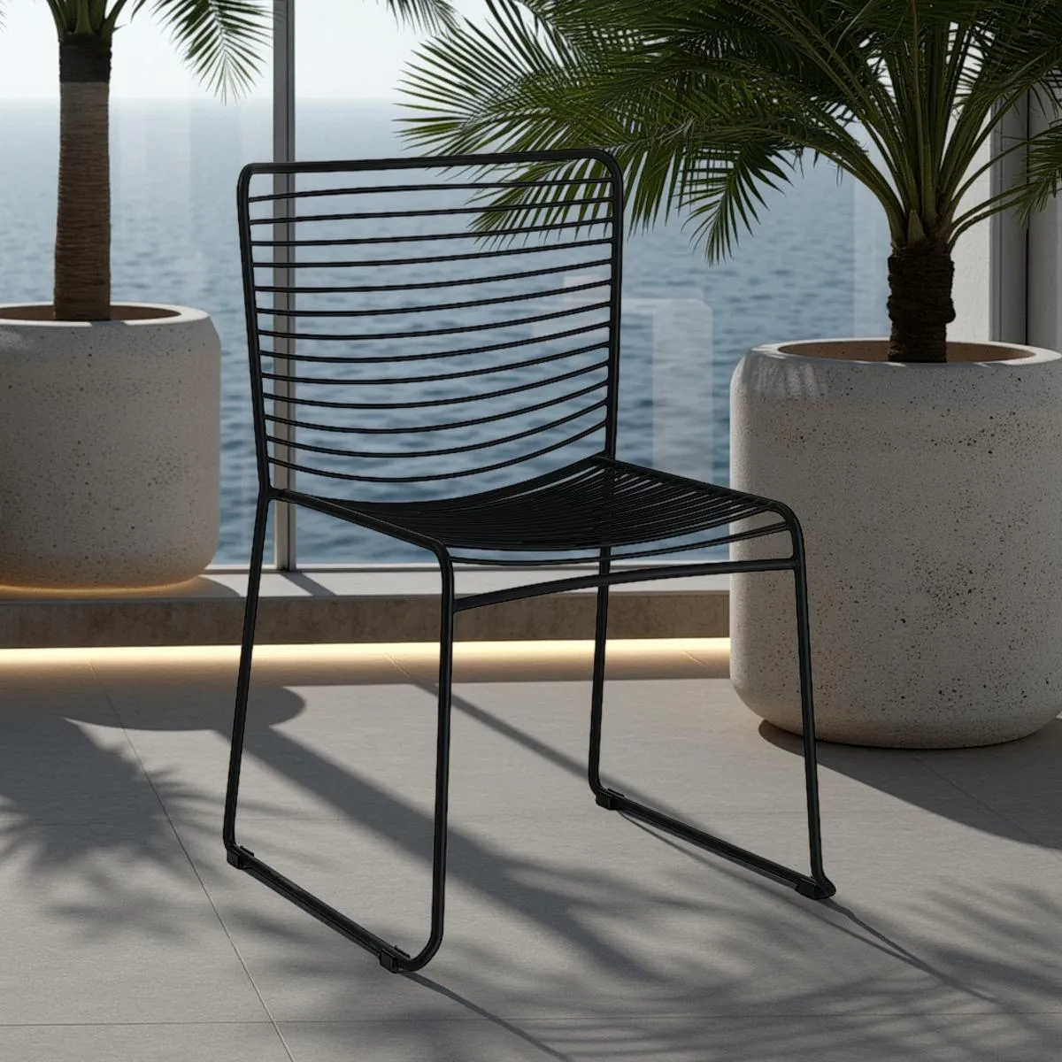 Sedia Martha Black Tomasucci in acciaio nero su un terrazzo