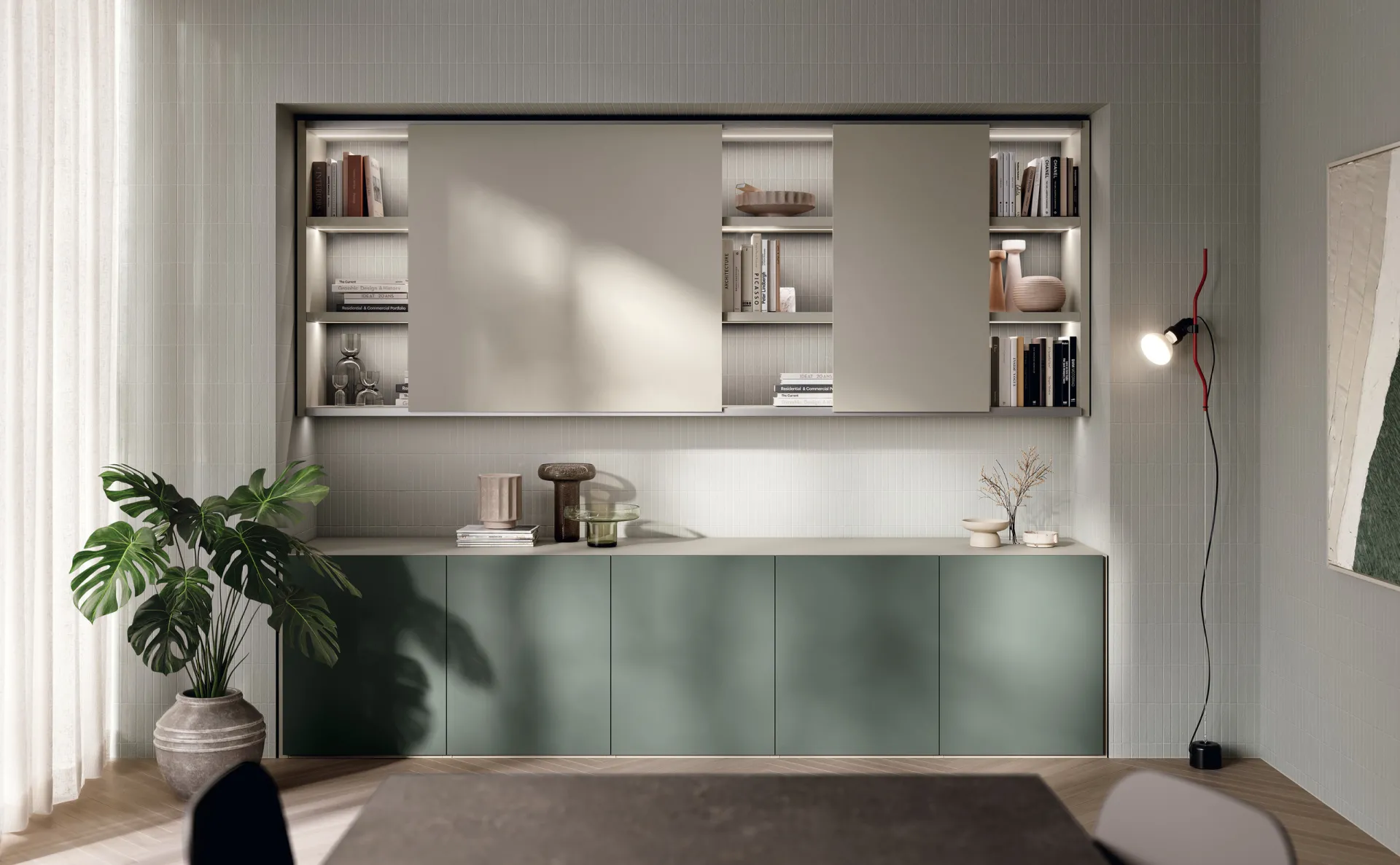 Soggiorno Regola Scavolini con basi verde Selva e Sistema Parete Fluida con ante scorrevoli Canapa