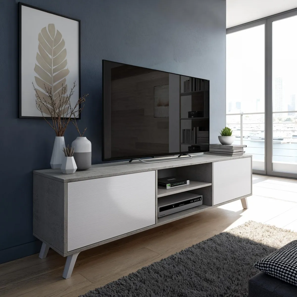 Porta TV Smart Tomasucci larice bianco e cemento sotto il televisore