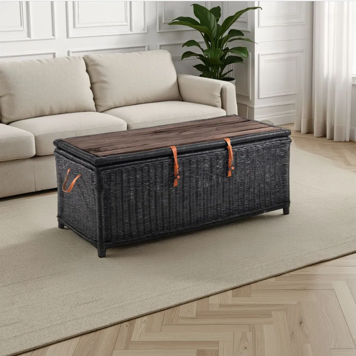 Tavolino contenitore Rino Black Tomasucci in rattan nero davanti al divano