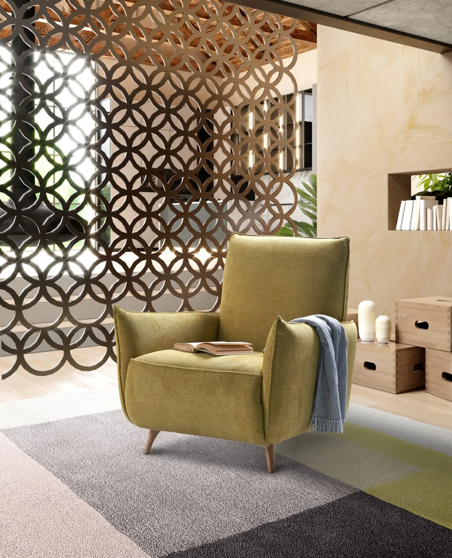 Poltroncina Dixie Il Benessere verde oliva con plaid in un soggiorno