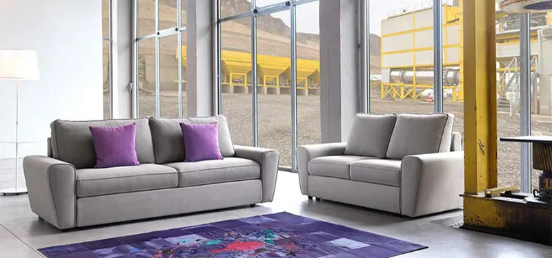 Due divani Duffy Domingo con cuscini viola
